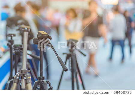 Tripod camera for sale at Trade show on photography equipment. Tripod camera for sale at Trade show on photography equipment. 59408723