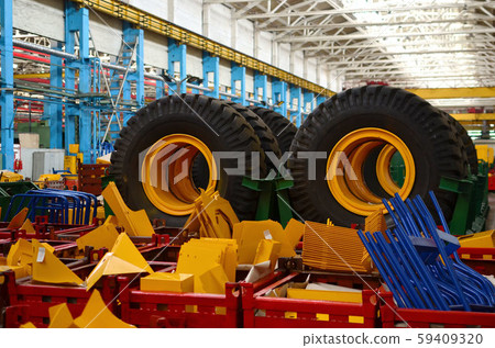 Warehouse with tires for trucks at an industrial plant for the production of cars 59409320