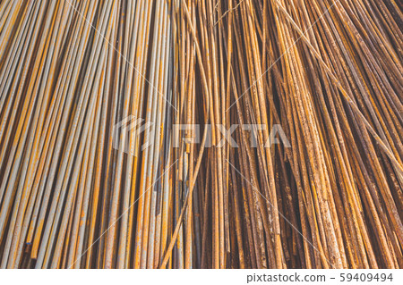Background texture of old rusty steel bars construction materials in a construction site Background texture of old rusty steel bars construction materials in a construction site 59409494
