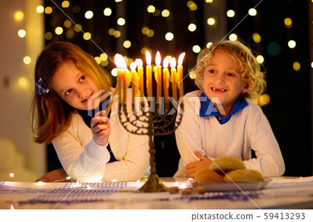 Kids celebrating Hanukkah. Festival of lights. Kids celebrating Hanukkah. Festival of lights. 59413293
