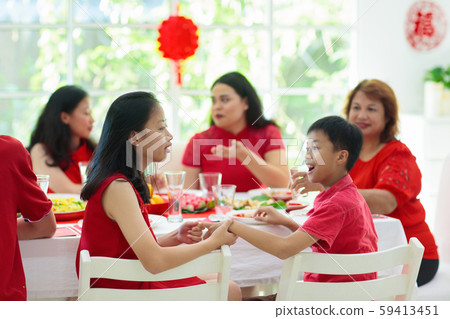 Chinese New Year family celebration. 59413451