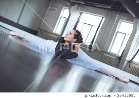 Young ballet dancer practice twine in studio active lifestyle Young ballet dancer practice twine in studio active lifestyle 59413693