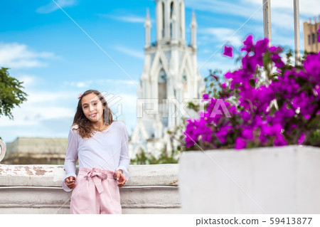 Girl on the Ortiz Bridge with the gothic church of La Ermita built on 1602 in the city of Cali Girl on the Ortiz Bridge with the gothic church of La Ermita built on 1602 in the city of Cali 59413877