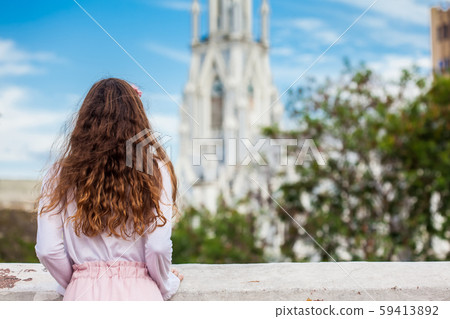 Girl on the Ortiz Bridge looking at the famous gothic church of La Ermita built on 1602 in Cali Girl on the Ortiz Bridge looking at the famous gothic church of La Ermita built on 1602 in Cali 59413892