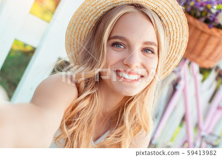 Young woman blonde hair summer style concept 59413982
