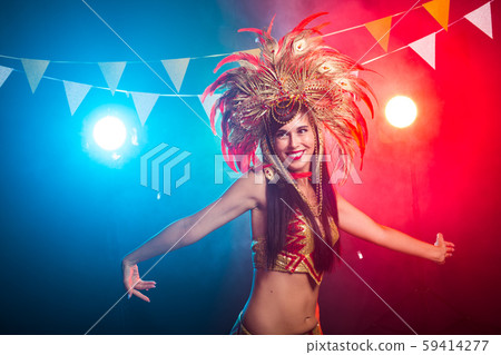 Carnival, dancer and holiday concept - Portrait of a sexy female in a colorful sumptuous carnival 59414277