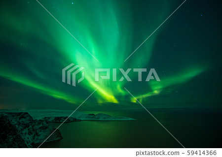 Intense northern lights, Aurora Borealis over Knivskjelloden Island, view from Nordkapp, North Cape Intense northern lights, Aurora Borealis over Knivskjelloden Island, view from Nordkapp, North Cape 59414366