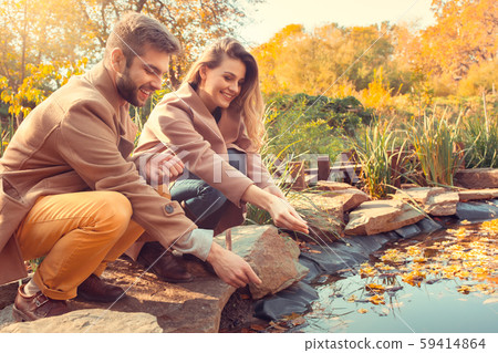 Young couple walk in the autumn park 59414864