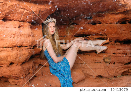 Young woman  in crown from shells sitting in the Young woman  in crown from shells sitting in the 59415079