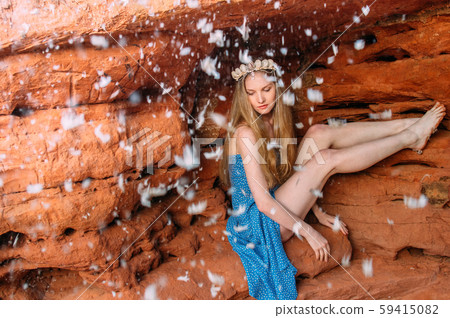 Young woman in crown from shells sitting in the Young woman in crown from shells sitting in the 59415082