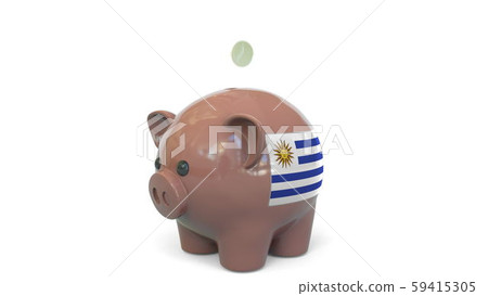 Putting money into piggy bank with flag of Uruguay. Tax system system or savings related conceptual 59415305
