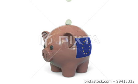 Putting money into piggy bank with flag of the European Union. EU banking system or savings related 59415332