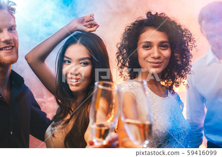 Group of friends party together indoors celebration Group of friends party together indoors celebration 59416099
