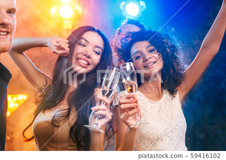Group of friends party together indoors celebration Group of friends party together indoors celebration 59416102