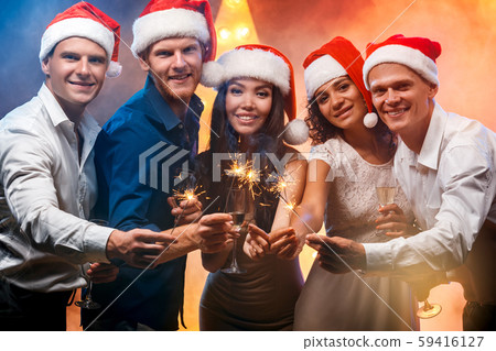Group of friends party together indoors celebration Group of friends party together indoors celebration 59416127