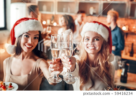 Group of friends party together indoors celebration Group of friends party together indoors celebration 59416234