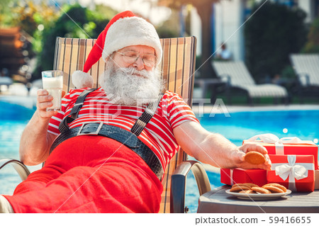 Santa Claus near the pool holiday vacation concept Santa Claus near the pool holiday vacation concept 59416655