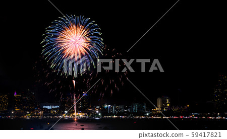 Happy new year fireworks over cityscape at Happy new year fireworks over cityscape at 59417821