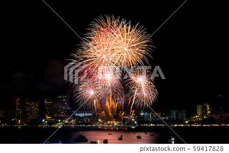 Happy new year fireworks over cityscape at 59417828