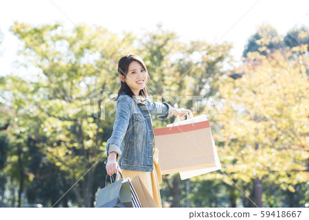 Young woman shopping bargain 59418667