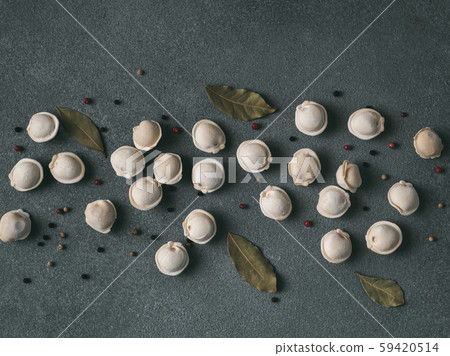 Beautiful scattered raw pelmeni on marble background Beautiful scattered raw pelmeni on marble background 59420514
