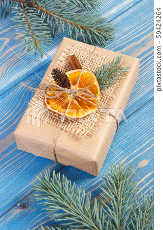 Wrapped gift with decoration for Christmas 59424264