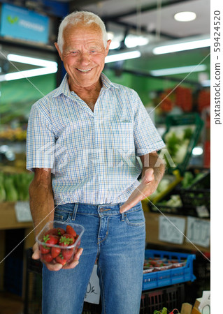 Man choosing fruits in market Man choosing fruits in market 59424520