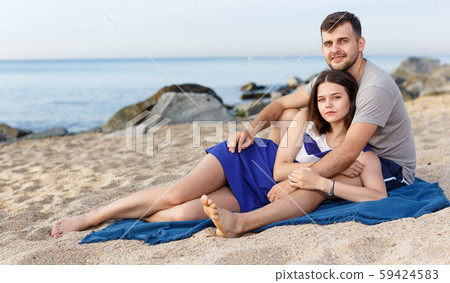 Positive loving couple resting and hugging Positive loving couple resting and hugging 59424583