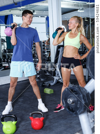 Couple during weightlifting workout 59424681