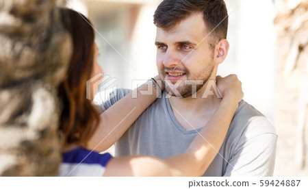 Happy man and girl talking and hugging Happy man and girl talking and hugging 59424887