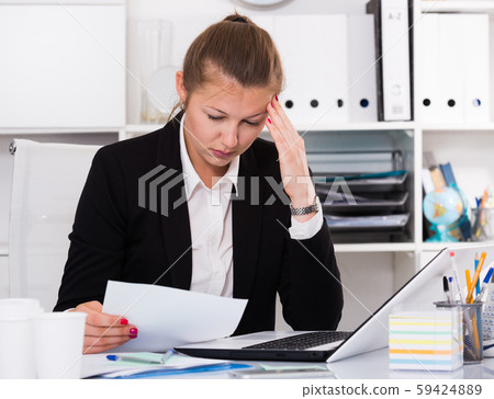 Office worker woman in black suit is having complicated issue with project Office worker woman in black suit is having complicated issue with project 59424889