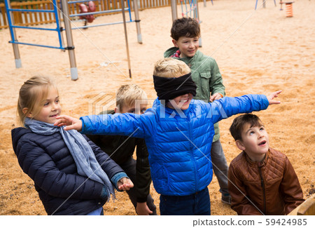 Children play in the blind man's buff Children play in the blind man's buff 59424985