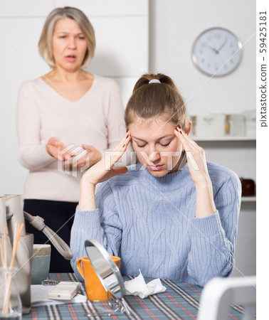 Senior mother lecturing her adult daughter Senior mother lecturing her adult daughter 59425181