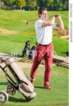 Male golf player made successful hit at golf course Male golf player made successful hit at golf course 59425492