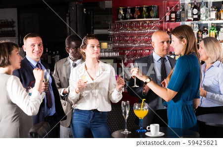Two young women drinking cocktails Two young women drinking cocktails 59425621
