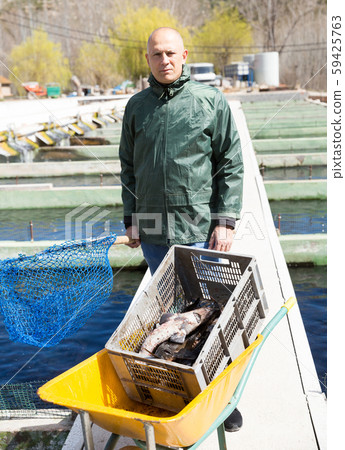 Portrait of man fish farm worker 59425763