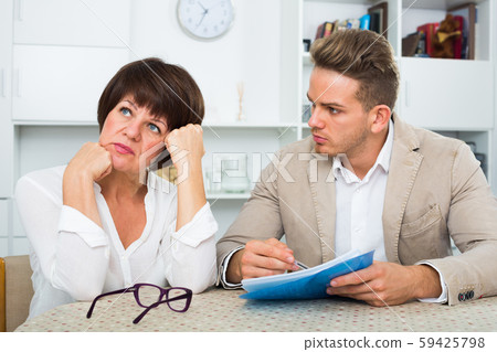 Elderly woman has discontentedly turned away Elderly woman has discontentedly turned away 59425798