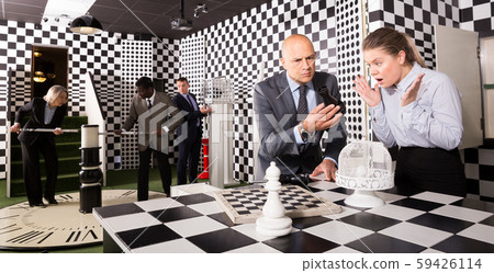 Group of colleagues solving puzzle Group of colleagues solving puzzle 59426114