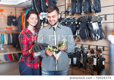 Couple deciding on protective gloves 59426374