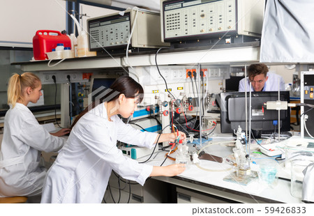 Attentive Chinese female scientist at lab Attentive Chinese female scientist at lab 59426833