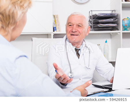 Male doctor with female client 59426915