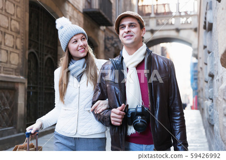 Tourists standing with camera Tourists standing with camera 59426992