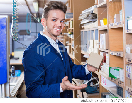 Male worker choosing items for work 59427001