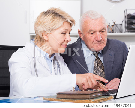 Female doctor with male client Female doctor with male client 59427041