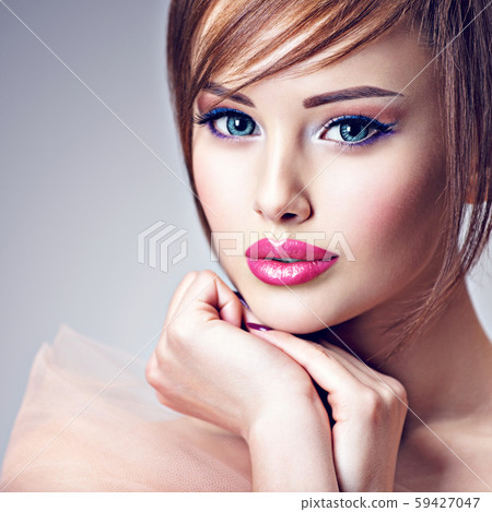 Attractive young woman with beautiful big blue 59427047