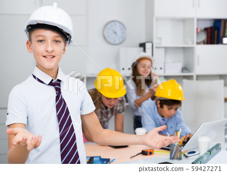 Teen boy in color helmet builder Teen boy in color helmet builder 59427271