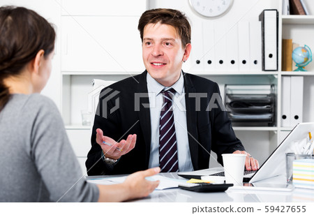 Man with companion sitting at the table Man with companion sitting at the table 59427655