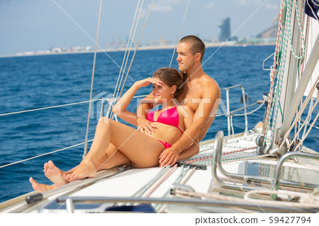 Couple sailing on yacht along Spanish coast Couple sailing on yacht along Spanish coast 59427794