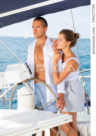 Couple steering yacht 59427799
