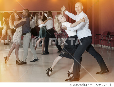 People dancing slow ballroom dances in pairs People dancing slow ballroom dances in pairs 59427801